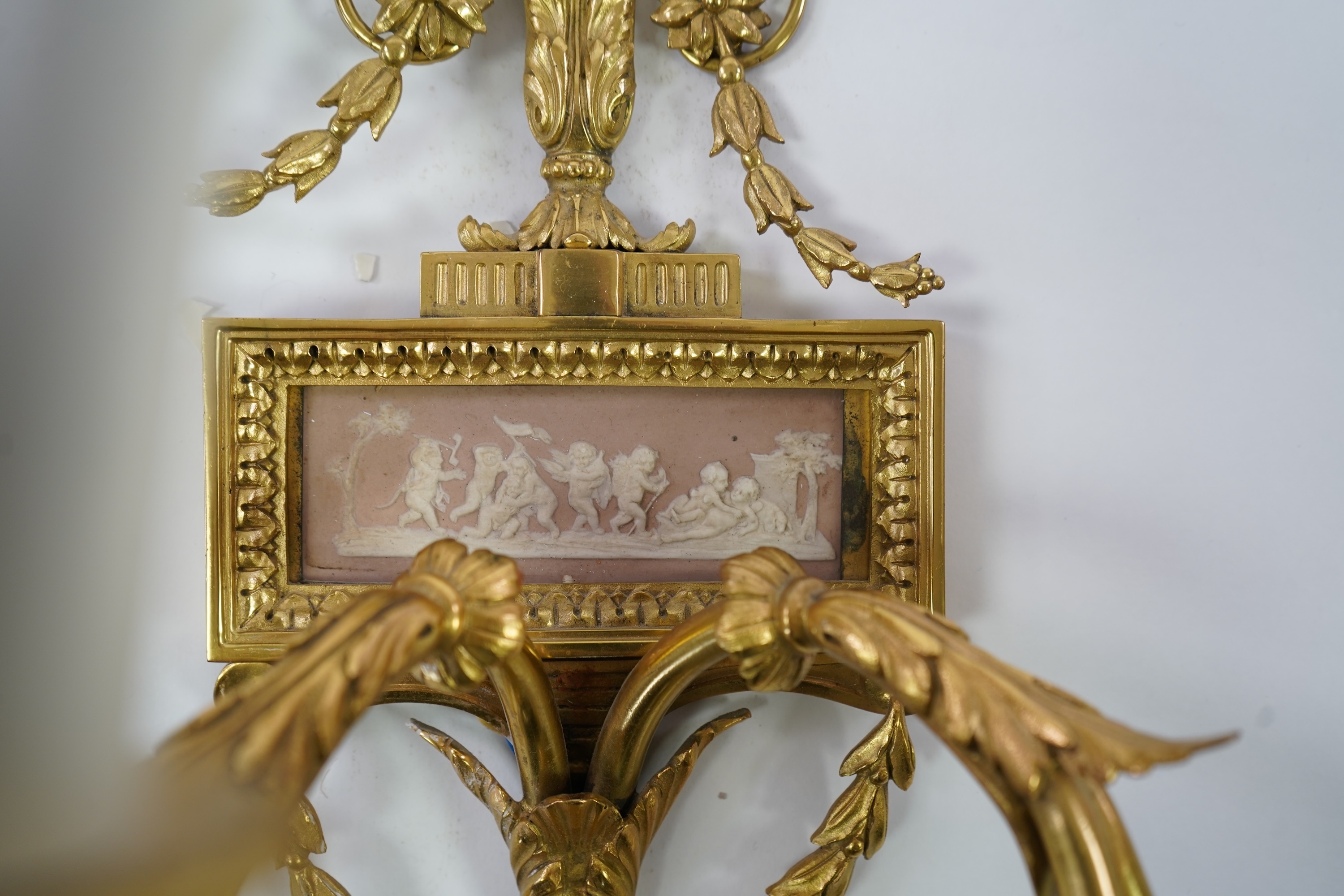 A set of four Adam style ormolu and jasper ware mounted wall appliques, early 20th century